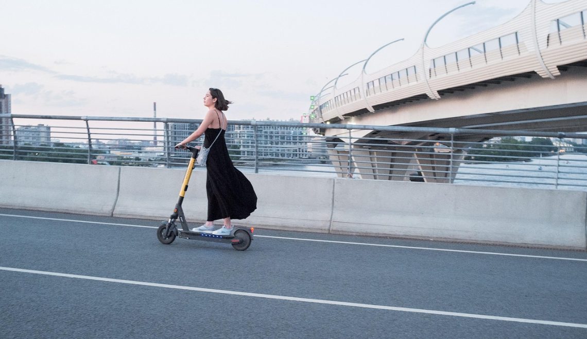 Woman riding an electric scooter