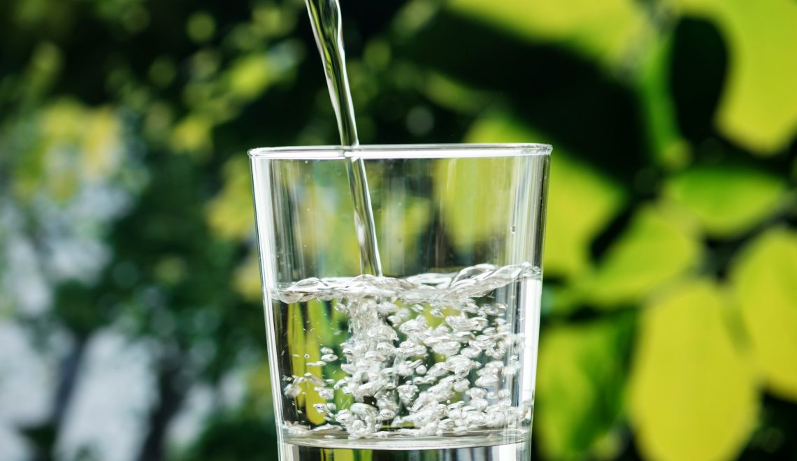 pouring water into a glass