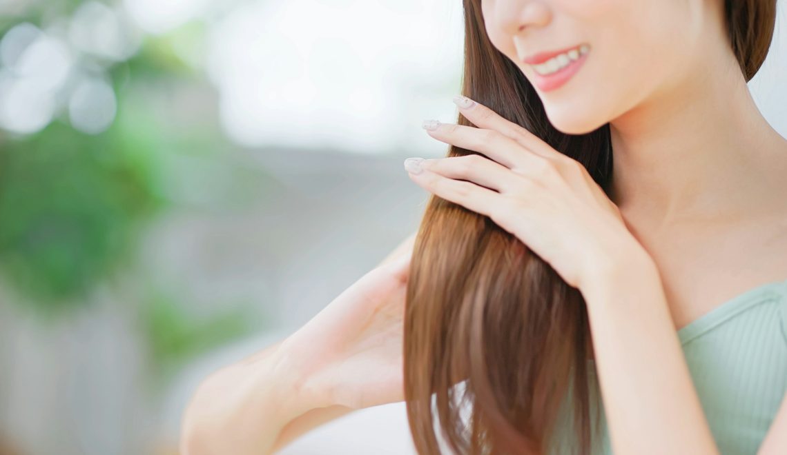 woman touching her hair