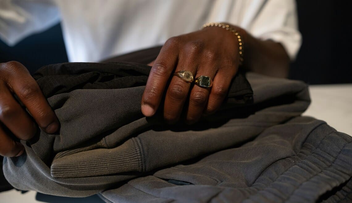 fashion wardrobe care - woman folding a pair of pants