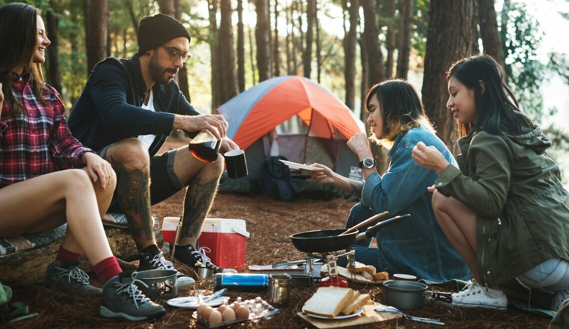 friends camping and preparing food