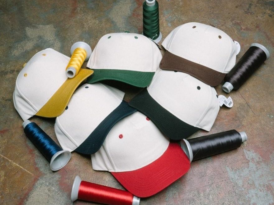 Collection of colorful baseball caps stacked together