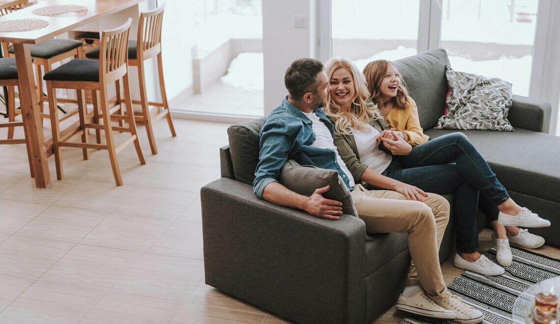 happy family sitting on a couch