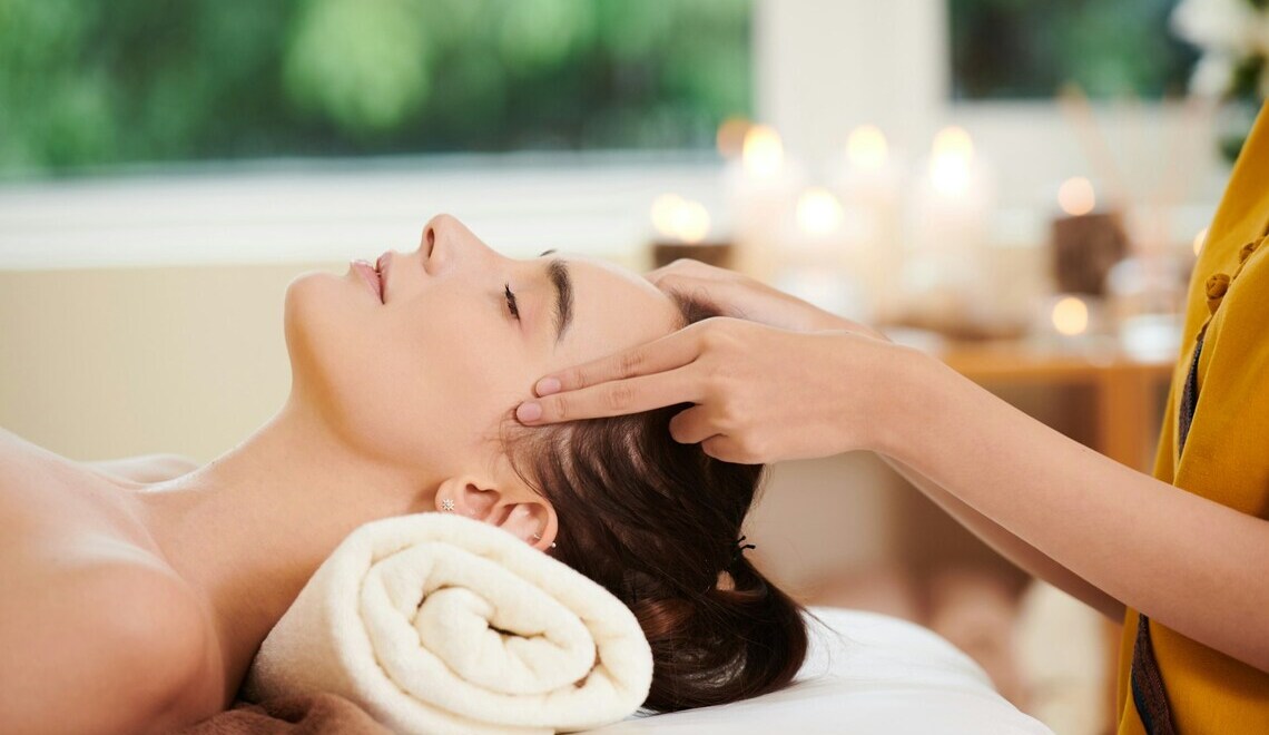 Woman receiving a massage at a spa