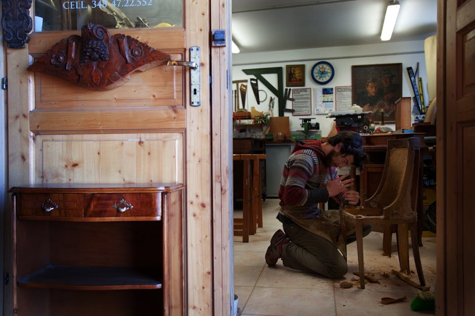 A craftsman working on solid-wood and metal office furniture