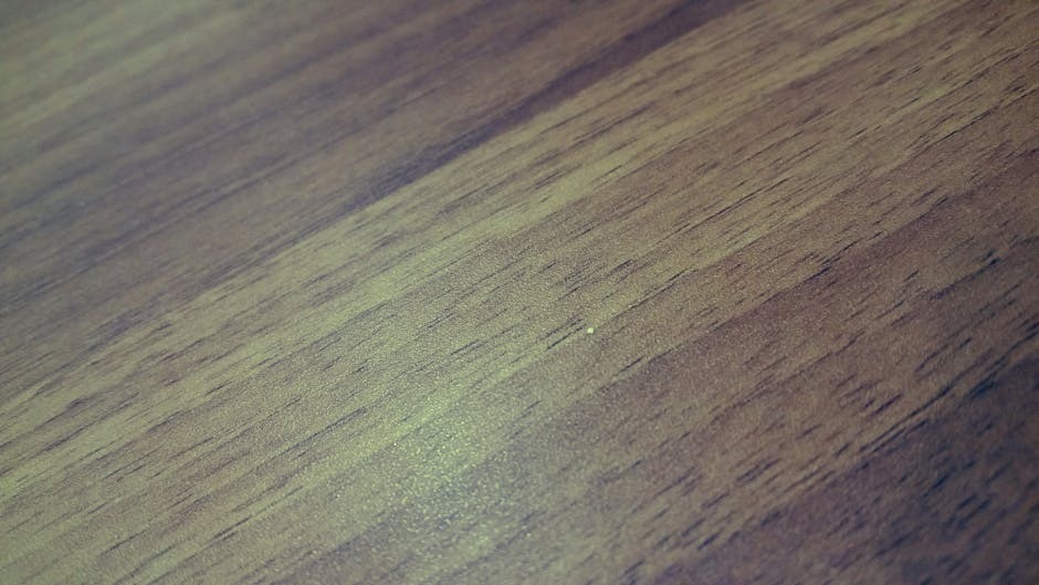 A close-up of a hardwood floor showing the grain texture and polished finish