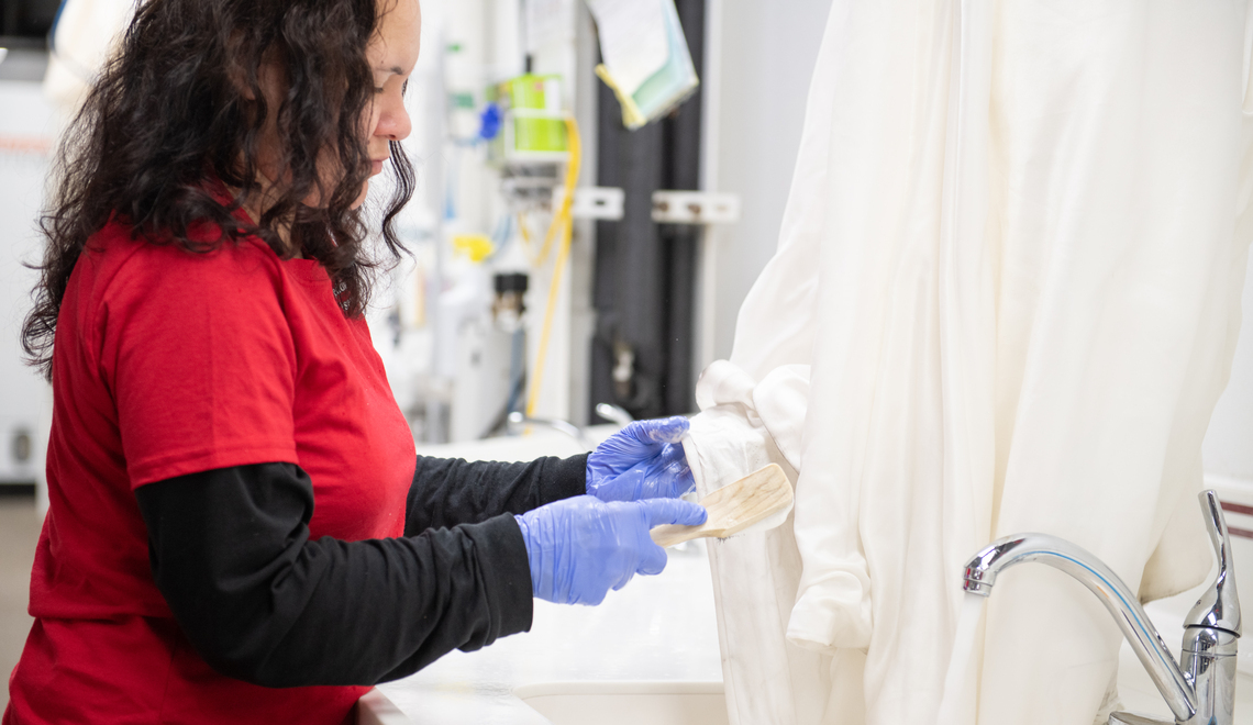 lady cleaning a wedding dress