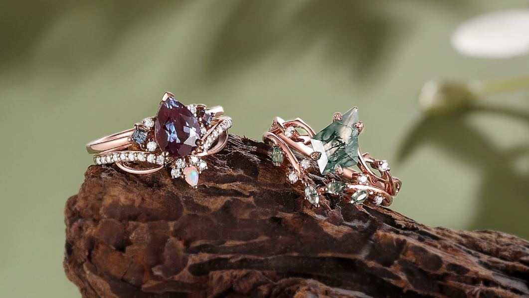 two engagement rings sitting on a branch