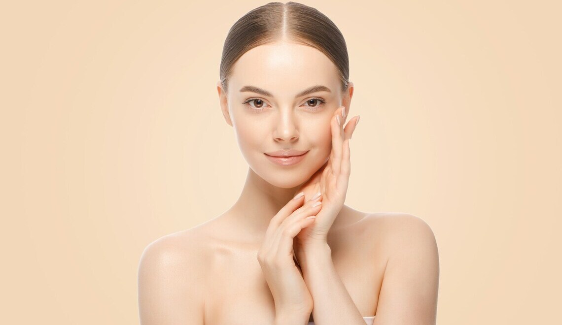 woman posing with hands touching face