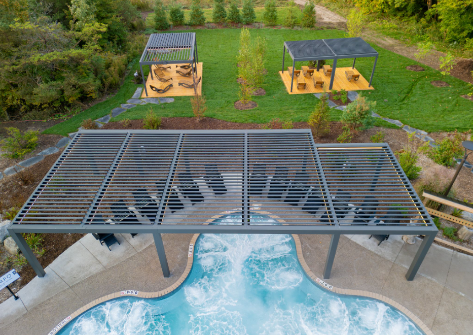 Louvered pergolas over pool and lounge areas