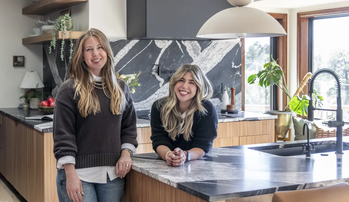 sister interior designers Kelly Smethills and Ann Marie Winkler at the Evergreen Ranch kitchen island