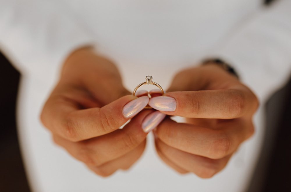 bride holding engagement ring