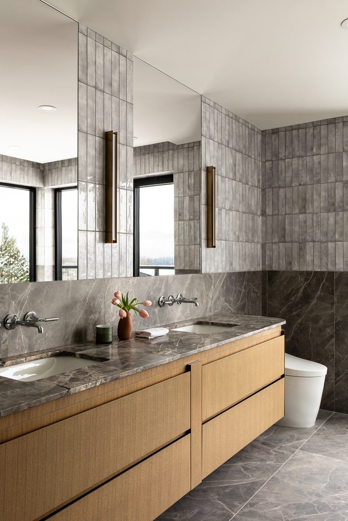 Interior by Atelier Fēn | Photo by Tina Kulic - luxury bathroom with gray tile and light wood cabinetry