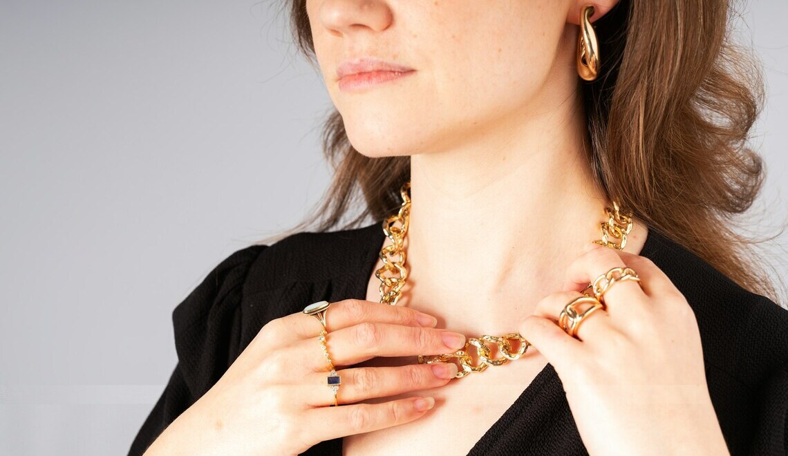 woman wearing gold jewelry