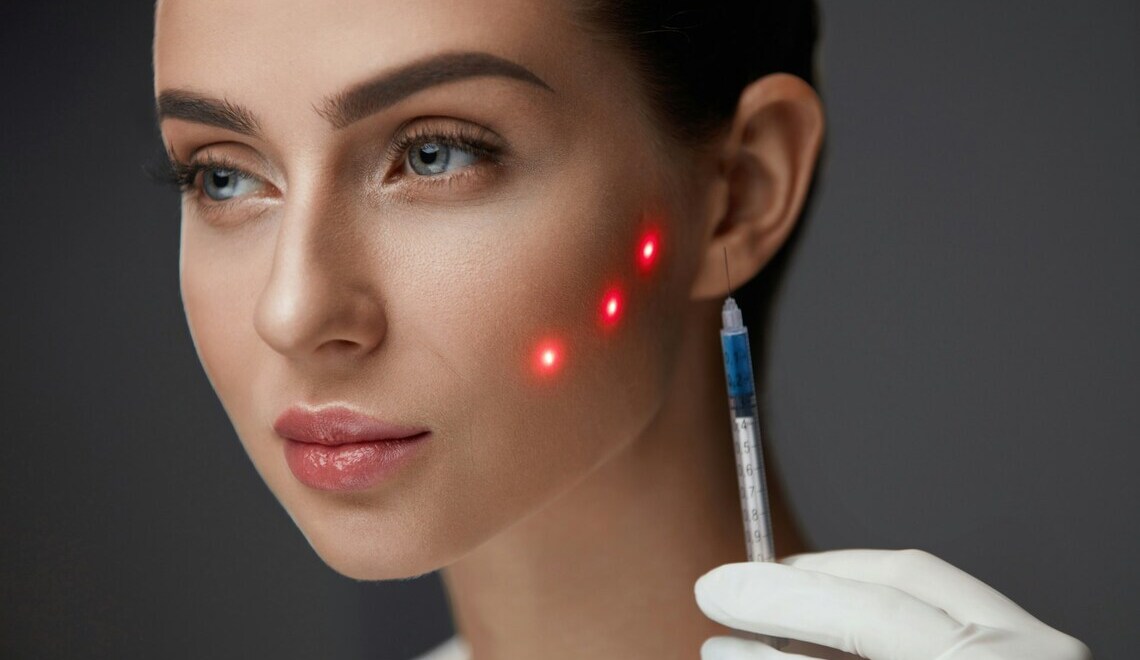 Woman receiving a cosmetic facial treatment