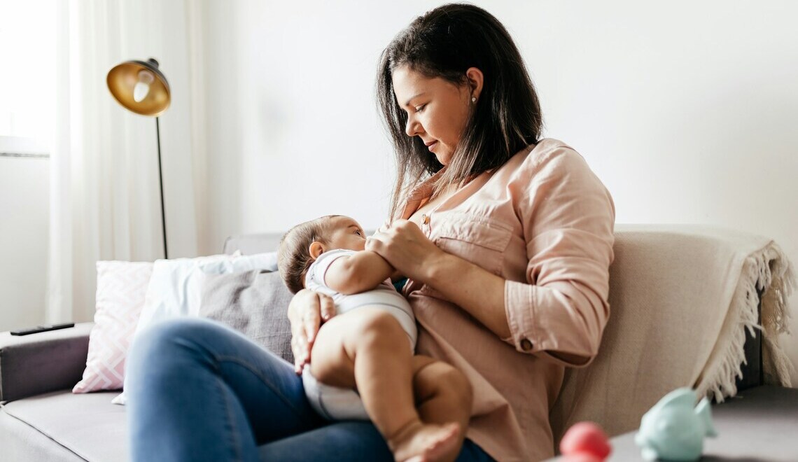 mother breastfeeding her baby