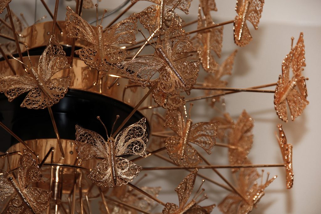 Close-up of filigree butterfly wings on a luxury chandelier
