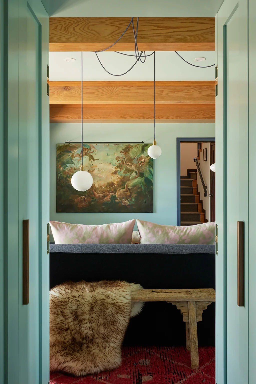spooky interior design mood in steven miller echo park home lemoyne with sage green millwork and antique oil painting