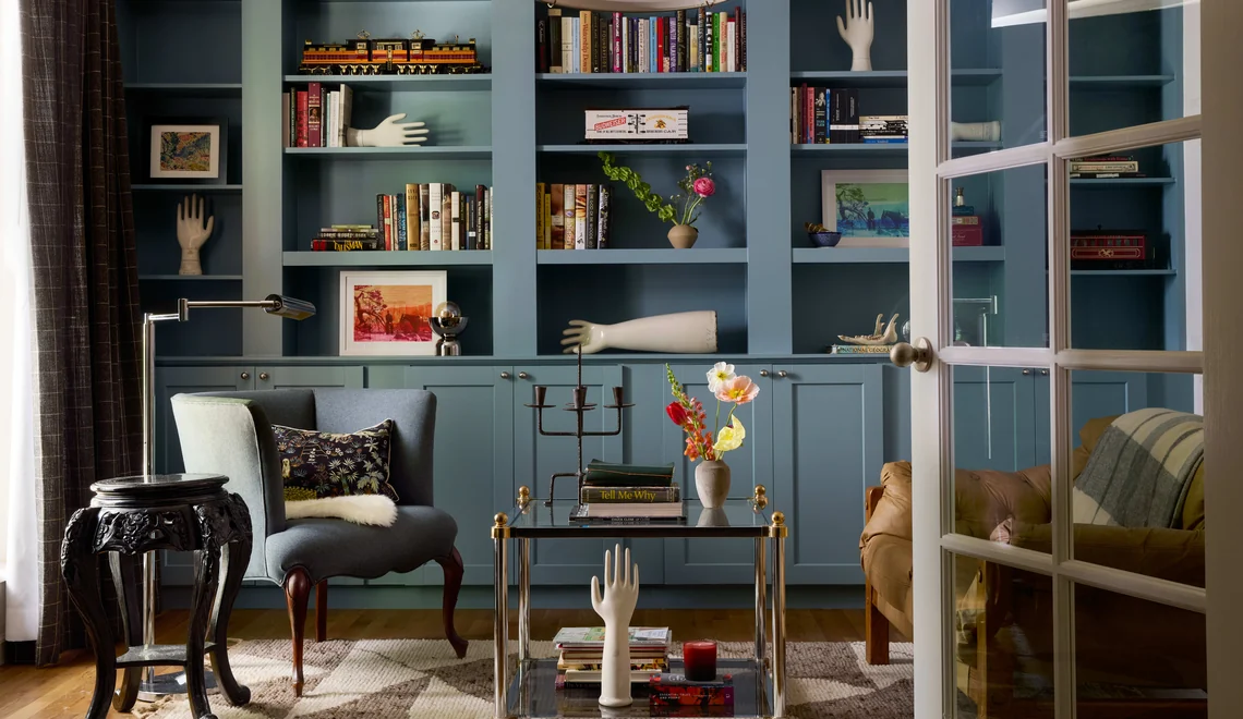 spooky interior design library with salvaged white porcelain hands by steven miller folk mod interiors