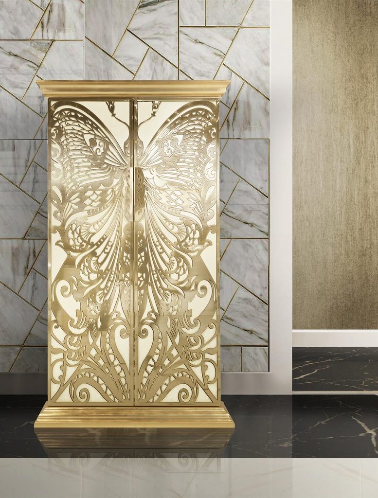 White and gold butterfly armoire in a marble interior